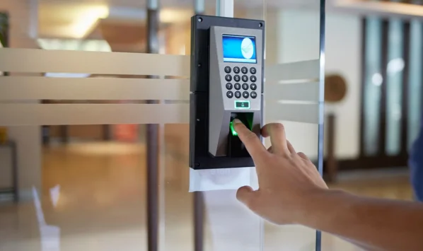 a-closeup-of-a-person-using-a-keypad-entry-system-to-get-into-a-commercial-building