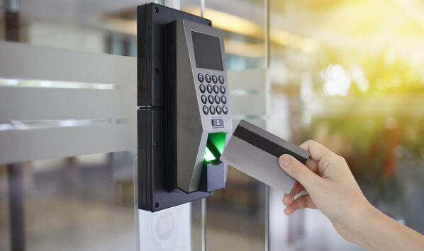 Young woman hold key card to access door office